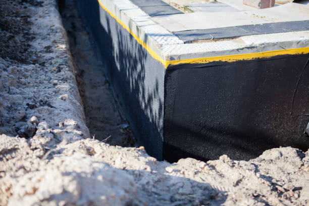 Professional Waterproofing technician working in Arnold, MD